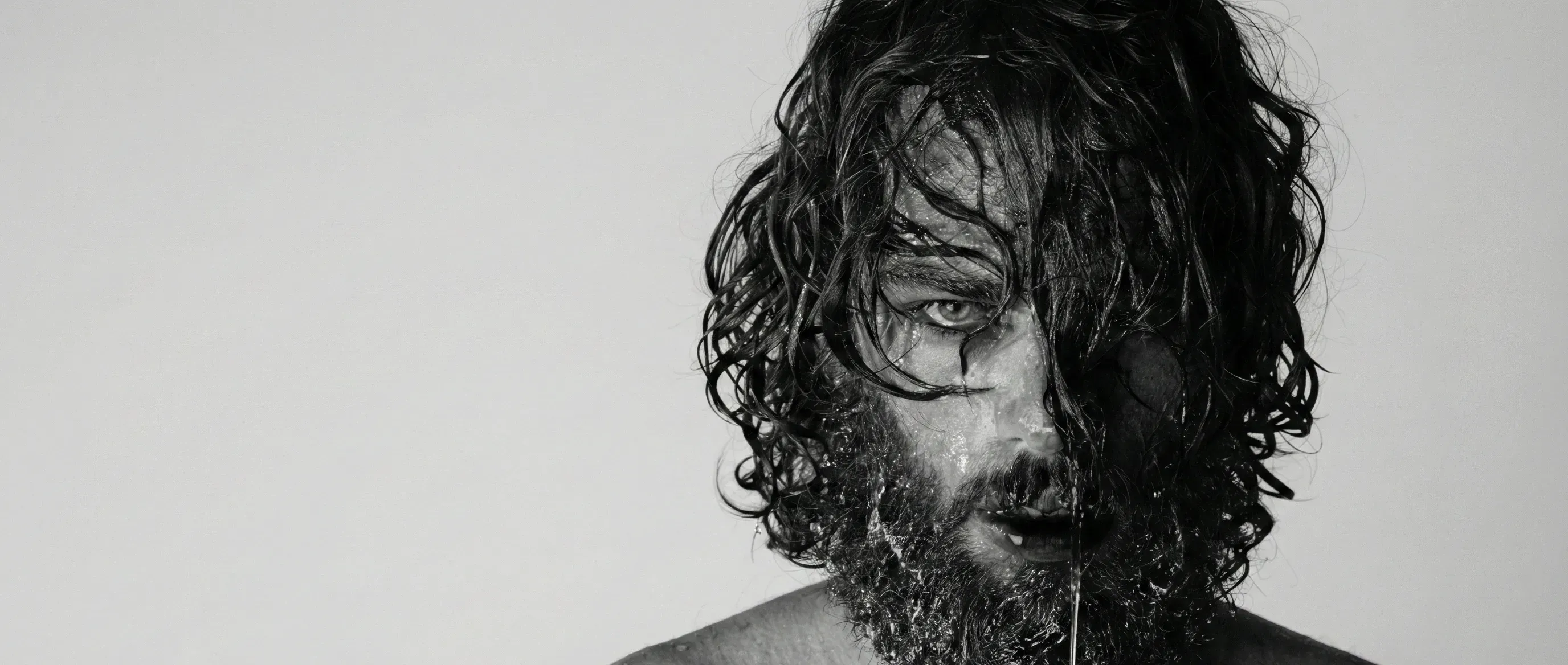 Woman lost in pleasure as a bearded man whispers commands, evoking intense intimacy